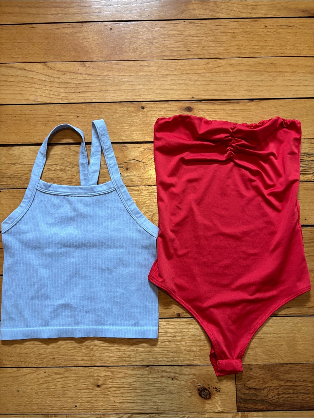 Baby blue racer back tank along with red bodysuit